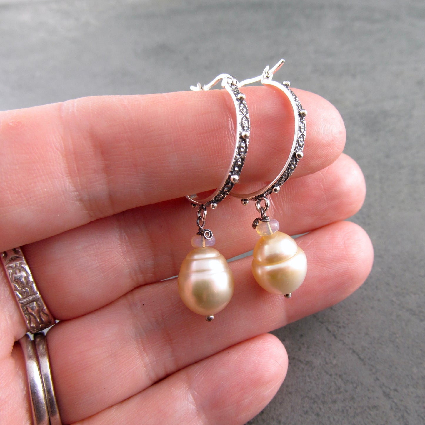 Sterling silver hoop earrings with gold South Sea pearls and Ethiopian opals