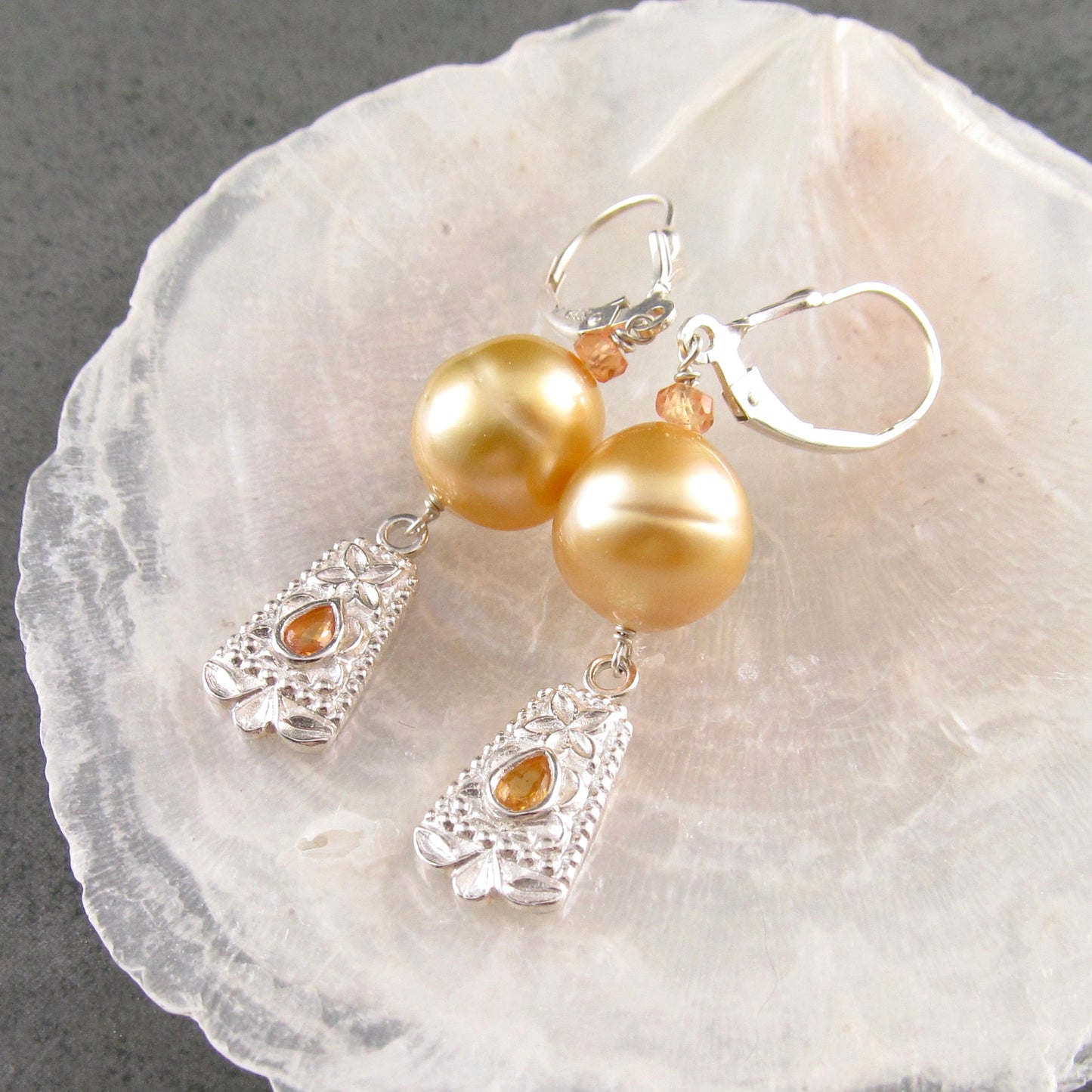 Gold South Sea pearl earrings with orange sapphire in fine silver