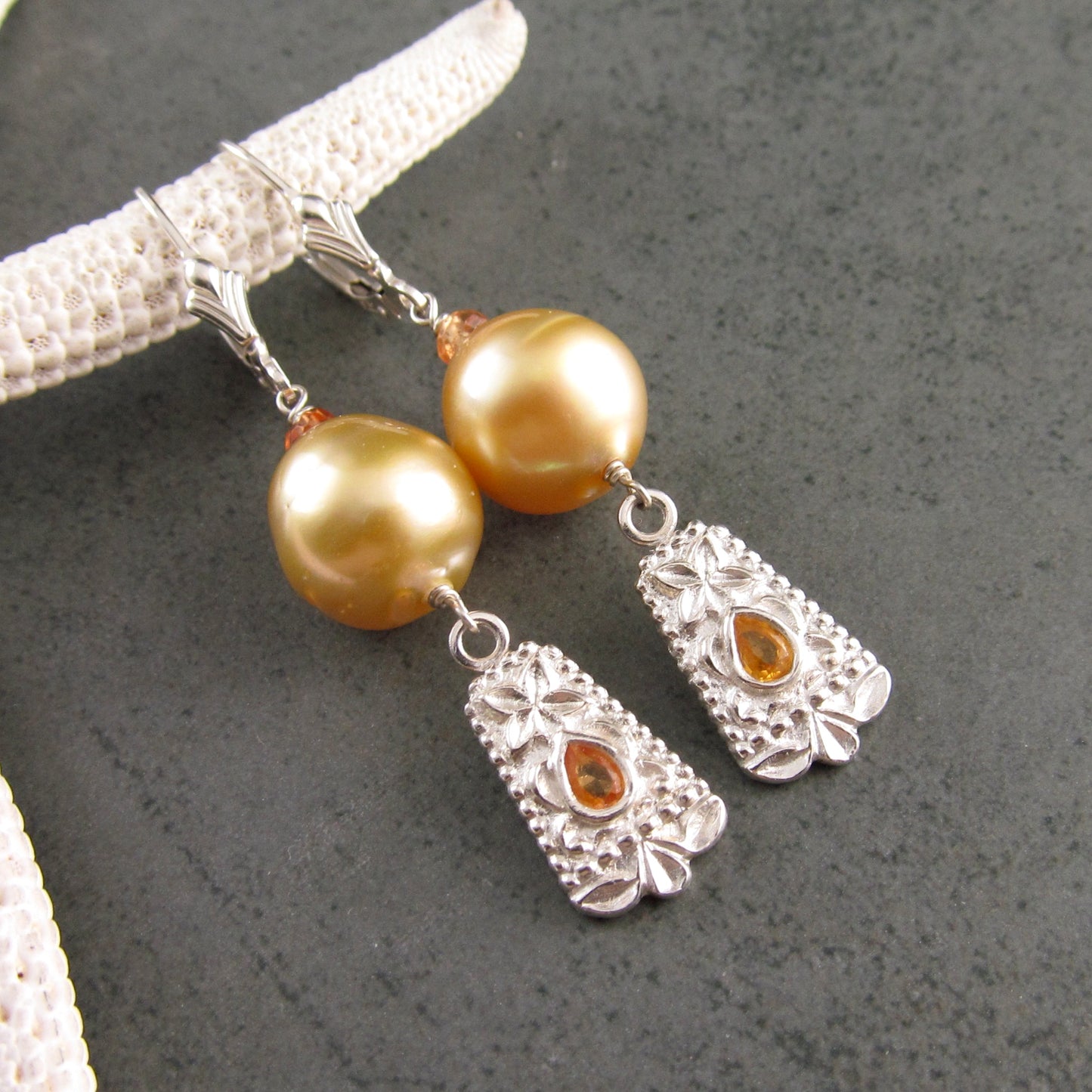 Gold South Sea pearl earrings with orange sapphire in fine silver