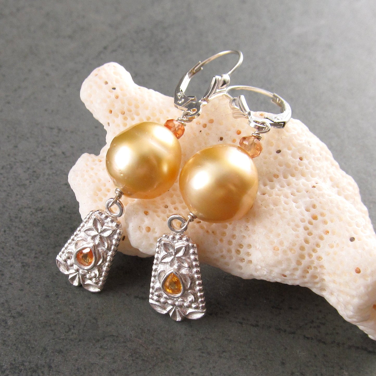 Gold South Sea pearl earrings with orange sapphire in fine silver