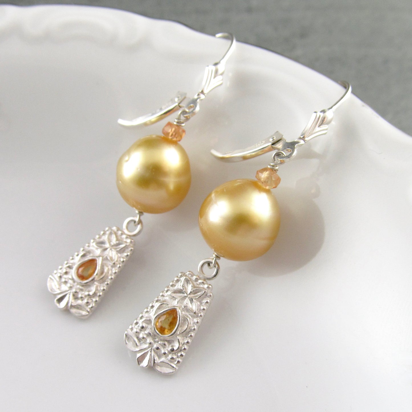 Gold South Sea pearl earrings with orange sapphire in fine silver