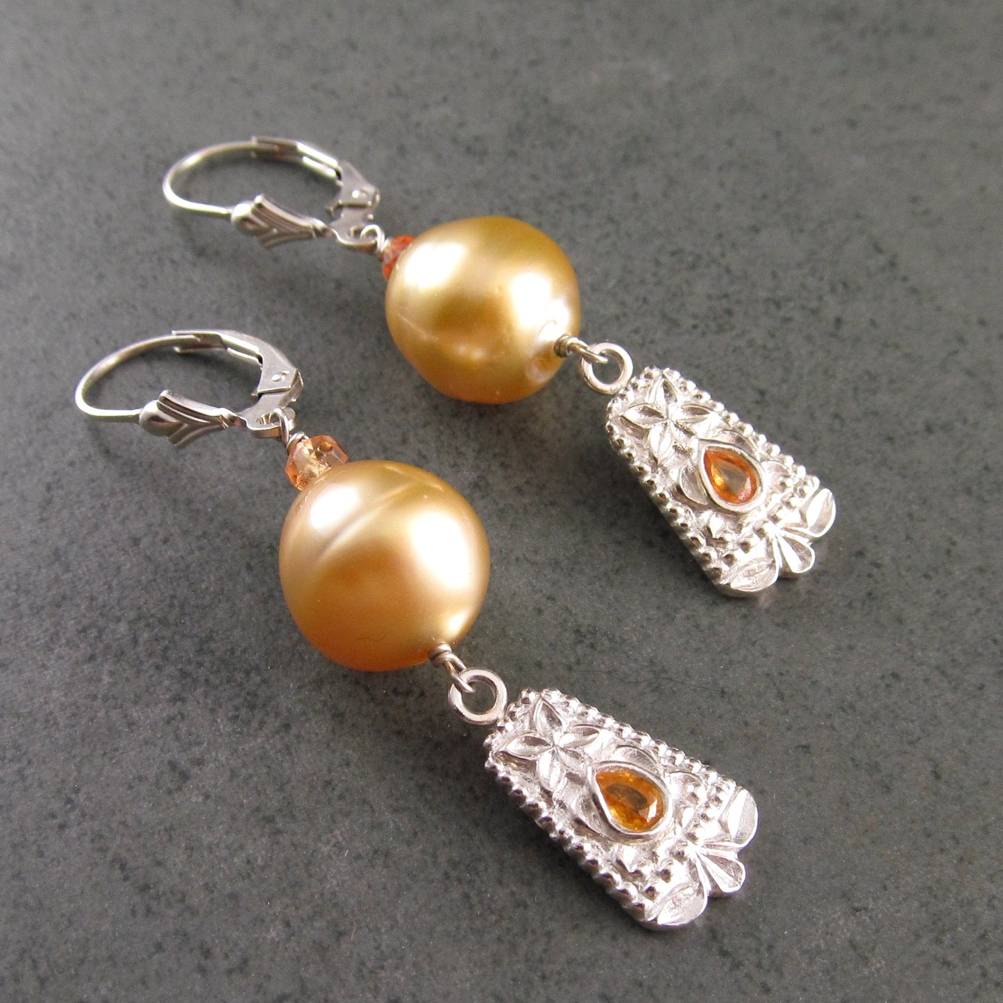 Gold South Sea pearl earrings with orange sapphire in fine silver