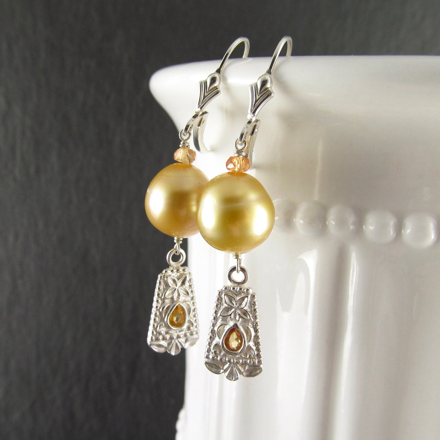 Gold South Sea pearl earrings with orange sapphire in fine silver