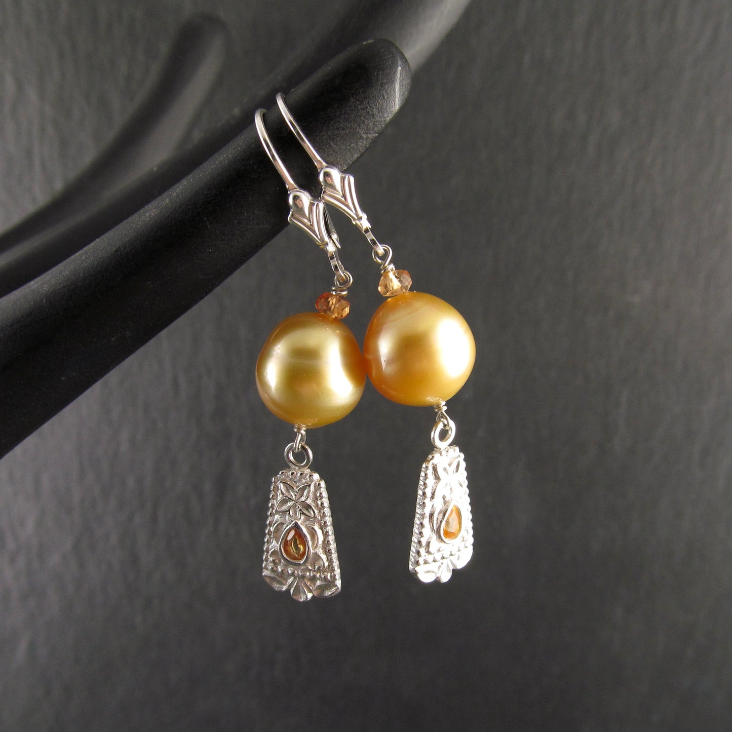 Gold South Sea pearl earrings with orange sapphire in fine silver