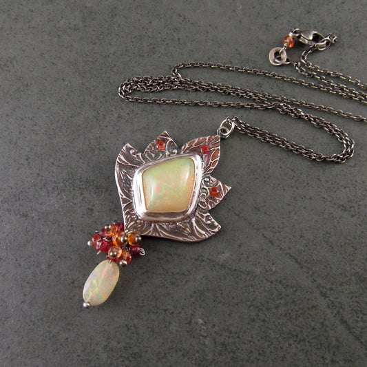 Ethiopian opal pendant with orange and red sapphires