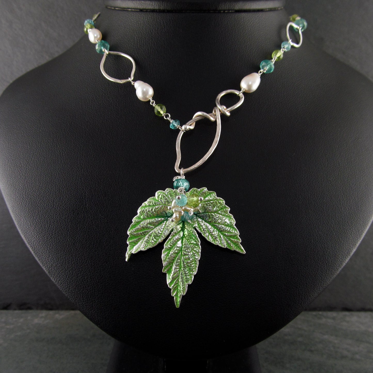 Peridot and apatite necklace with an enameled leaf and pearls in fine and sterling silver