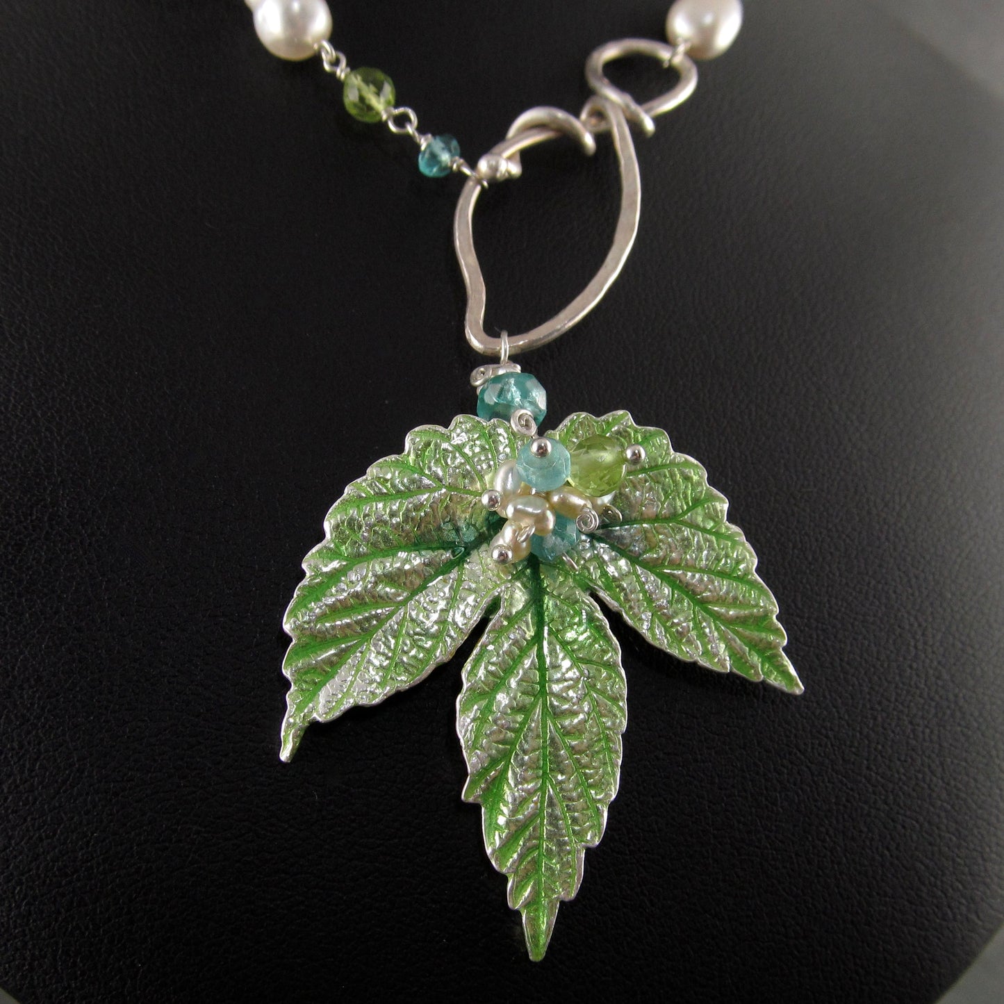 Peridot and apatite necklace with an enameled leaf and pearls in fine and sterling silver