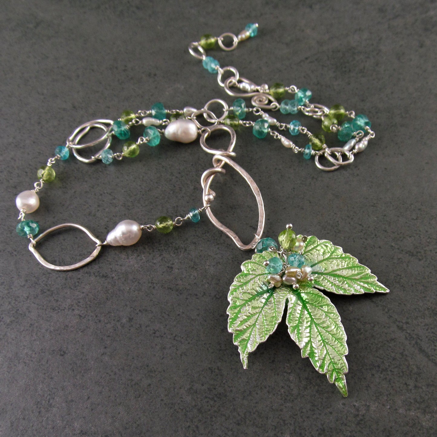 Peridot and apatite necklace with an enameled leaf and pearls in fine and sterling silver