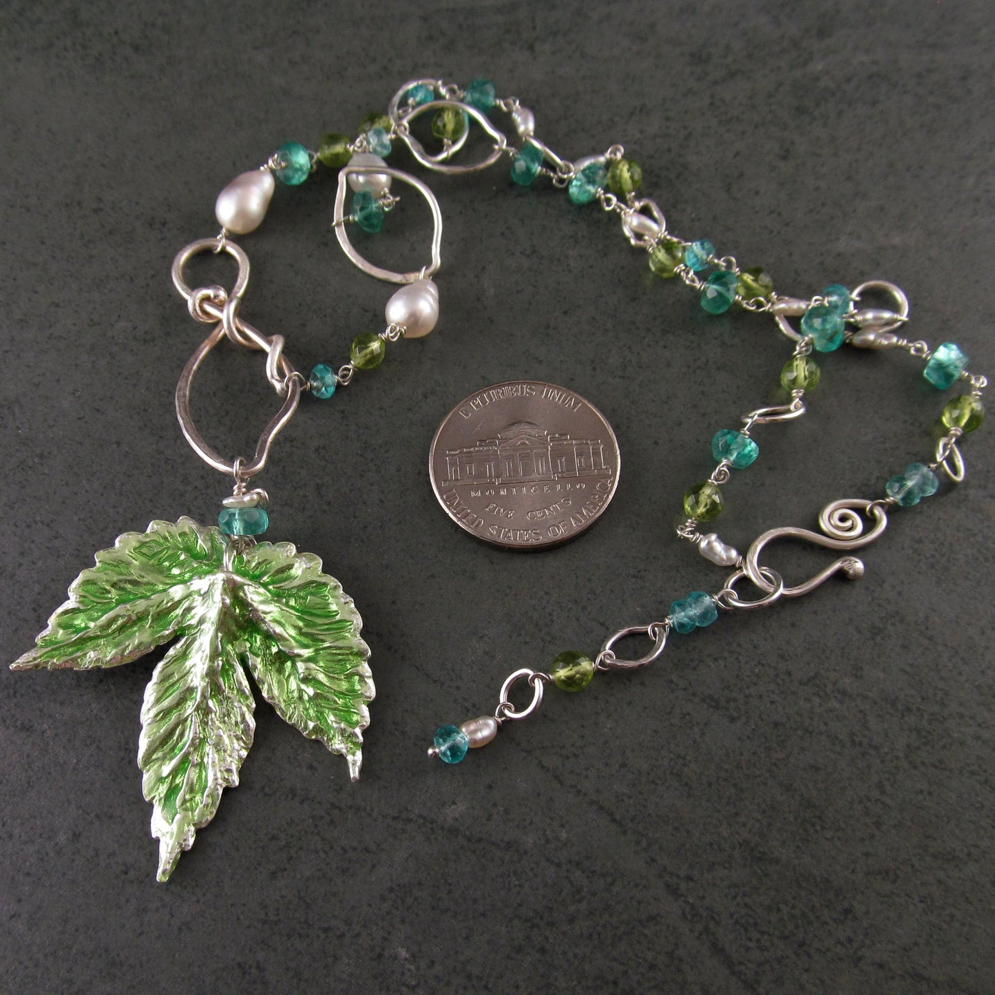 Peridot and apatite necklace with an enameled leaf and pearls in fine and sterling silver