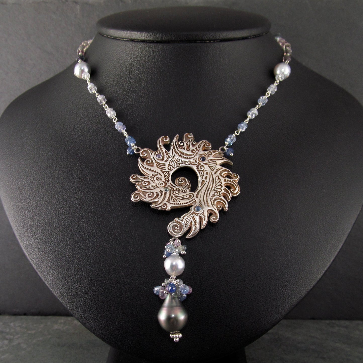 Ocean blue spiral shell fine silver pendant with sapphire and Tahitian and Akoya pearls
