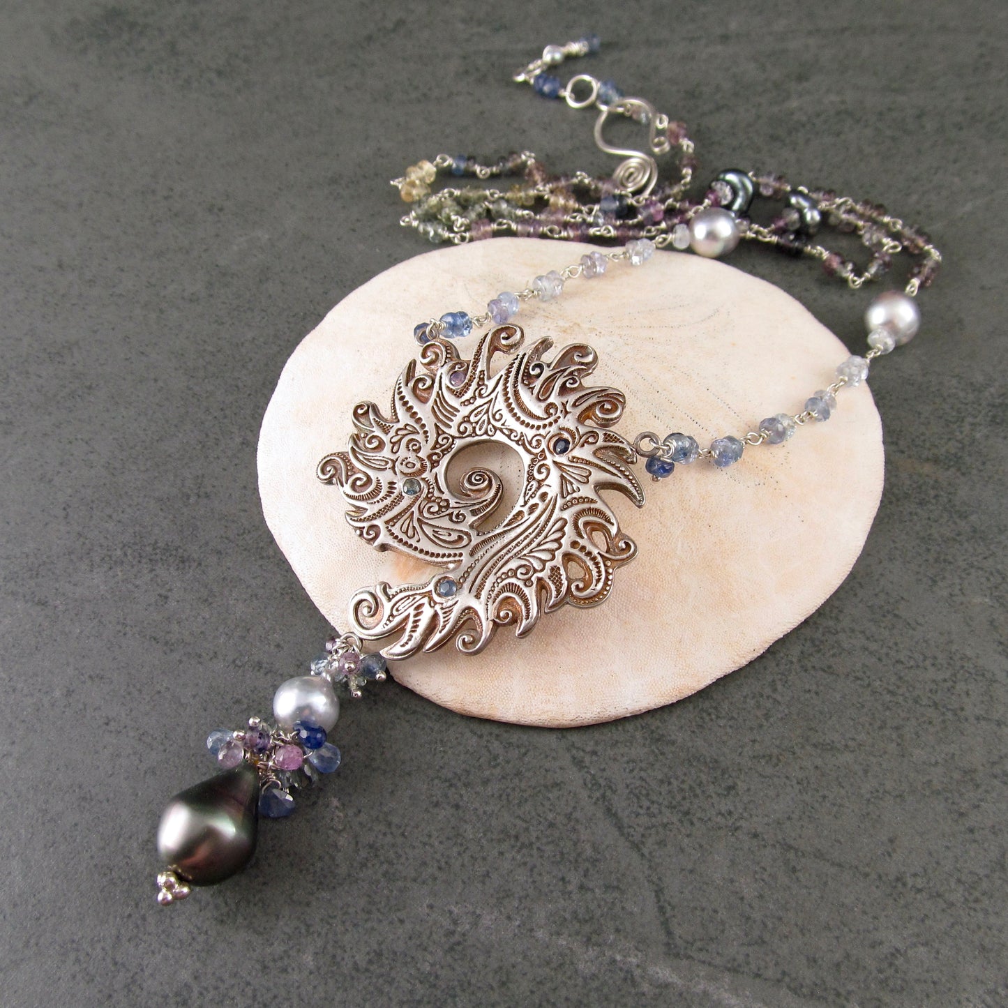 Ocean blue spiral shell fine silver pendant with sapphire and Tahitian and Akoya pearls