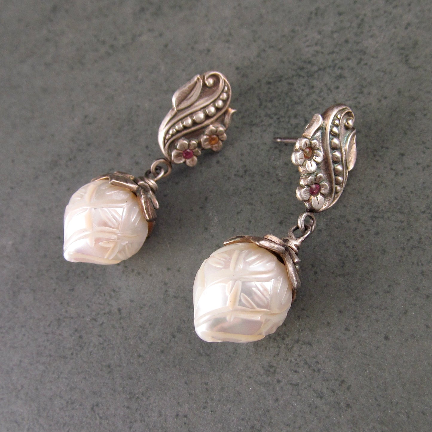 Carved pearl flower bud earrings in fine silver with pastel sapphires